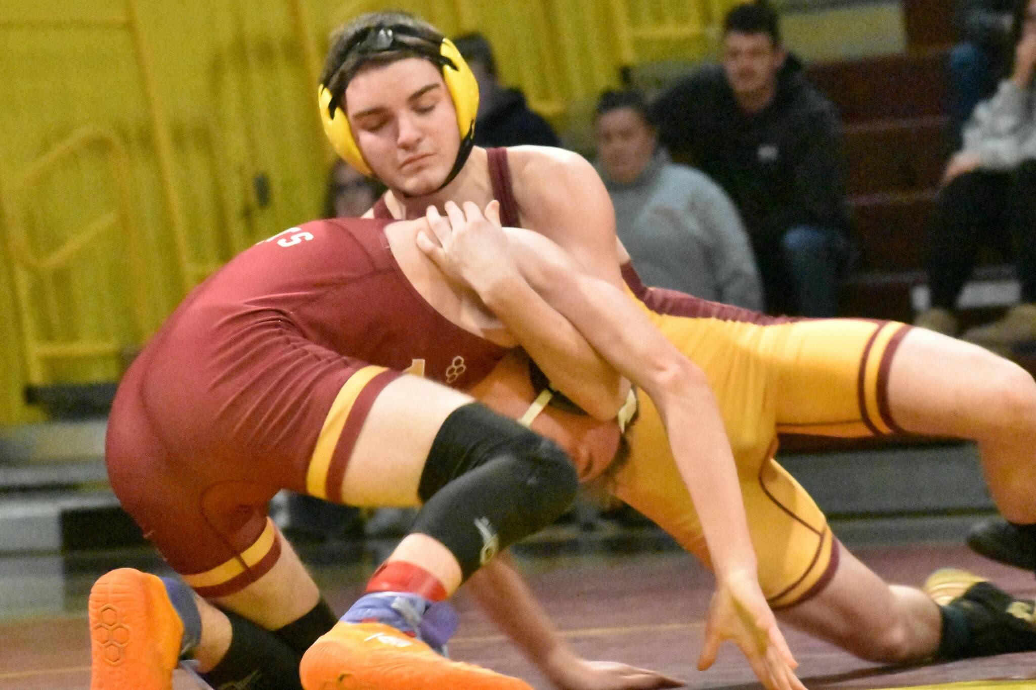Wrestlers from White River made the short trip to Enumclaw Highs Chuck Smith Gymnasium the evening of January 29 for the grappling version of the Battle of the Bridge. It was the Buckley-based Hornets who emerged victorious. In this photo, Enumclaws Caleb Grantham (yellow headgear) has the advantage at 144 pounds. Photo by Kevin Hanson
