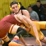 Wrestlers from White River made the short trip to Enumclaw Highs Chuck Smith Gymnasium the evening of January 29 for the grappling version of the Battle of the Bridge. It was the Buckley-based Hornets who emerged victorious. In this photo, Enumclaws Caleb Grantham (yellow headgear) has the advantage at 144 pounds. Photo by Kevin Hanson