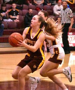The White River High girls wrapped up an undefeated NPSL 3A season Thursday night with a road victory at Enumclaw, earning Battle of the Bridge honors for a second time this season. Here, White River freshman Kaitlyn Hewlett drives to the hoop. For game details see Hoop Roundup.
PHOTO BY KEVIN HANSON