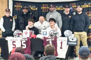Contributed photo 
Enumclaw High football players were joined by Hornet head coach Mark Gunderson during last weeks signing ceremony at the school. They are joined by assistant coaches Greg Naegle, Scott Eilertson, Coronel Smith, Gil Russell, Colby Thompson and Loren Standiford.