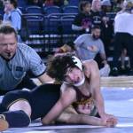 Photo by Kevin Hanson
Gemmell: Enumclaw High junior Gaven Gemmell was a Mat Classic force at 106 pounds, winning four of his six matches. Here he attempts to turn Max Park Taber on his way to registering a technical fall over his Franklin High opponent.