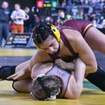 White Rivers Lilyana Lamothe pinned all four of her opponents during Mat Classic, earning a Class 3A championship in the 130-pound division. In this photo, she dominates Mariah Denney from University High (Spokane Valley). Photo by Kevin Hanson