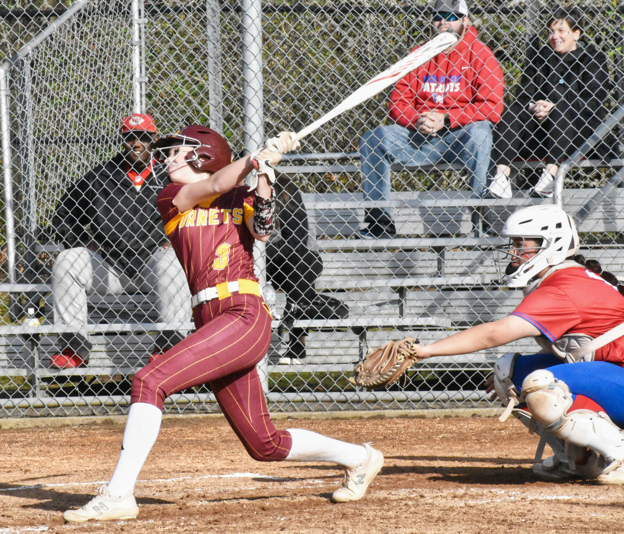 WRHS Kennedy Selander sending a ball to the outfield during a 2024 match against the Washington Patriots. Photo by Kevin Hanson