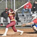 WRHS Kennedy Selander sending a ball to the outfield during a 2024 match against the Washington Patriots. Photo by Kevin Hanson