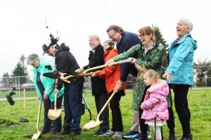 Pictured breaking ground at the Doc Tait Pavilion is Foothills Historical Society Treasurer Jean Contreras, Buckley City Council member Ron Smith, Pierce County Council member Dave Morell, former Buckley Mayor and Foothills Rails to Trails Secretary Pat Johnson, former state Rep. Eric Robertson, former Rails to Trails Executive Shayla Miles, Rails to Trails Board member Robin Partington, and Pepper Miles. Photo by Ray Miller-Still