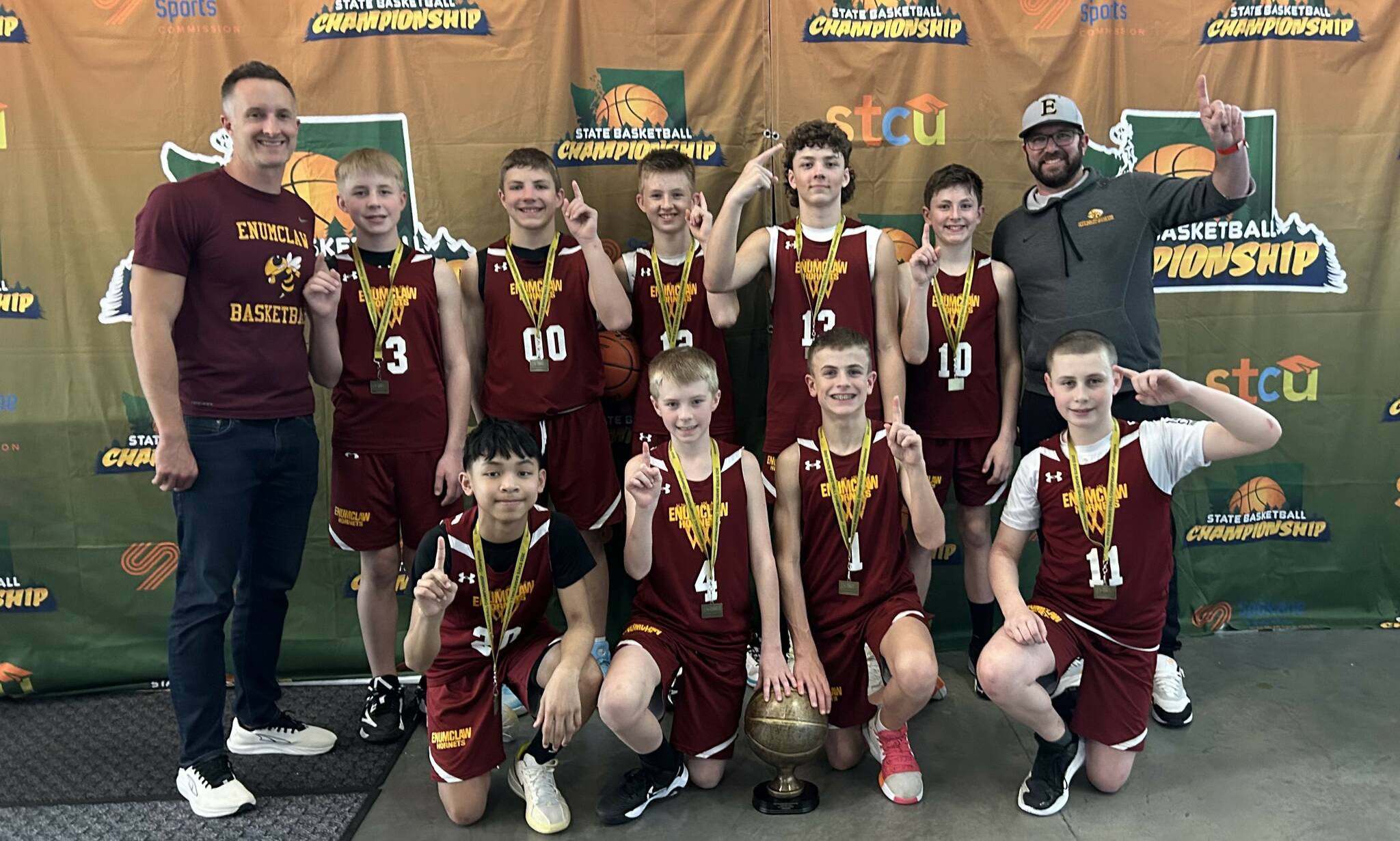 Contributed photo
A team of Enumclaw sixth-grade boys captured a state basketball championship by winning every game during a Spokane tournament. The squad, made up of students from both Enumclaw and Thunder Mountain middle schools, went 6-0 during the March 14-16 tourney. The victories came in dominant fashion as the team won by an average of 23 points per game. The team was coached by former Enumclaw High players Casey Hanson and Cameron Stratton. Pictured (in back, from left) are coach Stratton, Jace Martel, Levi Hanson, Case Stratton, Bo Barnes, Jake Bramlett and coach Hanson. In front, from left, are Payton Mercado, Wyatt Oliver, Tyson Thomas and Logan Johnson.