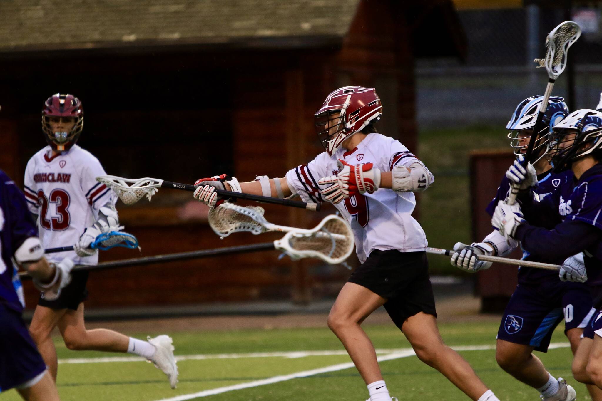 #9 Mauricio Ibarra Reyna drives through a swarm of defenders as he drives the alley. Photo by Todd Overdorf / sonscapeimages.com