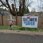 The Coury family placed their Slower is safer yard sign near the roadside memorial dedicated to their son, Gabriel, who was hit by a speeding drunk driver in 2023. Photo courtesy of Shellie Coury.