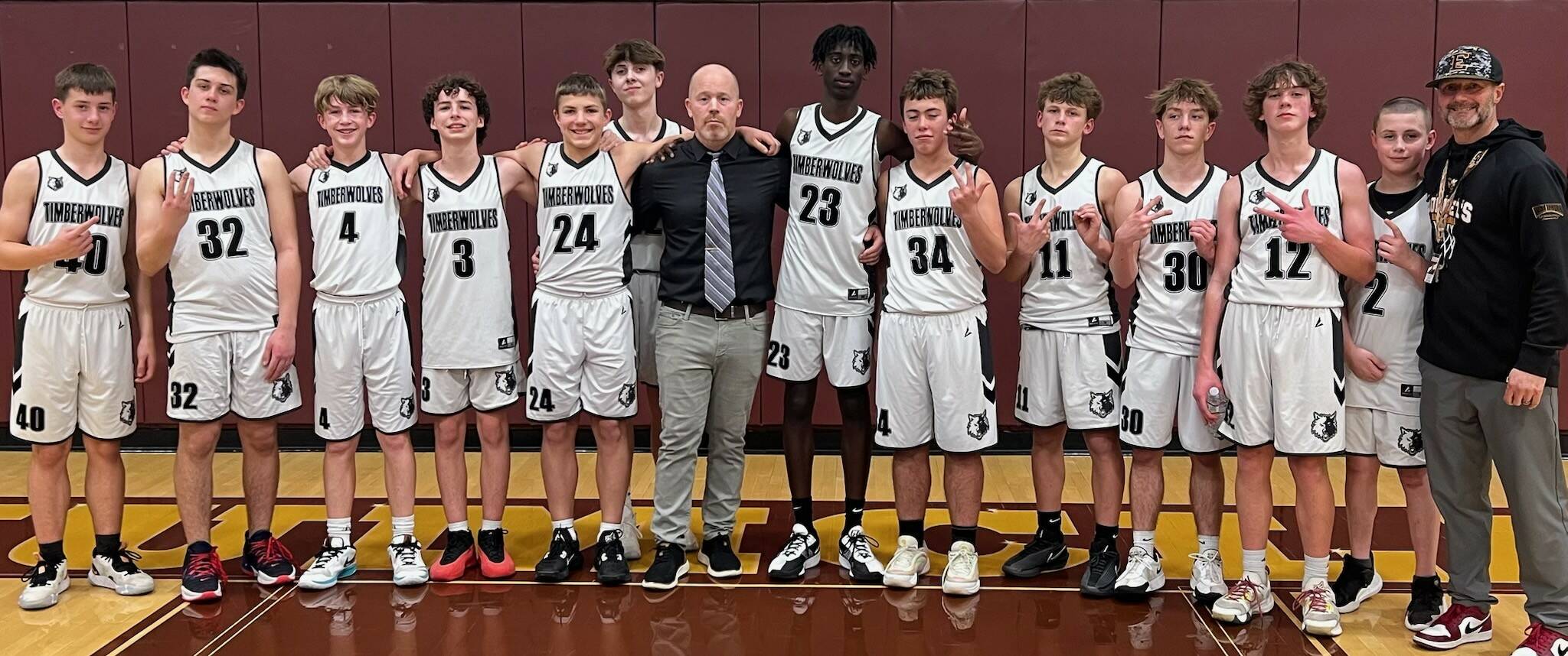 The Enumclaw Middle School boys basketball team earned a Plateau League championship by finishing their season with a perfect 10-0 record. Even more impressive, this marked the third year in a row the Timberwolves finished as undefeated league champs. The EMS team is a combined group of sixth-, seventh- and eighth-grade students.

“Coach Patterson and I have had great talent and amazing young men come through our program these last few years,” head coach Sam White said in an emailed report. “Their work ethic and high expectations is what has separated them from their competition.”

The accompanying photo was taken following the team’s final game of the season. Pictured, from left, are: Brice Dunham, Jack Connelly, Anderson Blair, Luke Cheney, Levi Hanson, Hunter Gura, head coach Sam White, Zelalem Poulin, Jack Wasson, Kortland Patterson, Liam Harding, Ryan McKee-Price, Logan Johnson and assistant coach Jason Patterson. Submitted photo