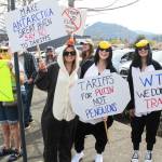 Pictured are Carlyn Hannum, Tellen Pranklin, and Veronica Perez in penguin costumes to ridicule the governments decision to put tariffs on remote, human-free islands. Photo by Ray Miller-Still