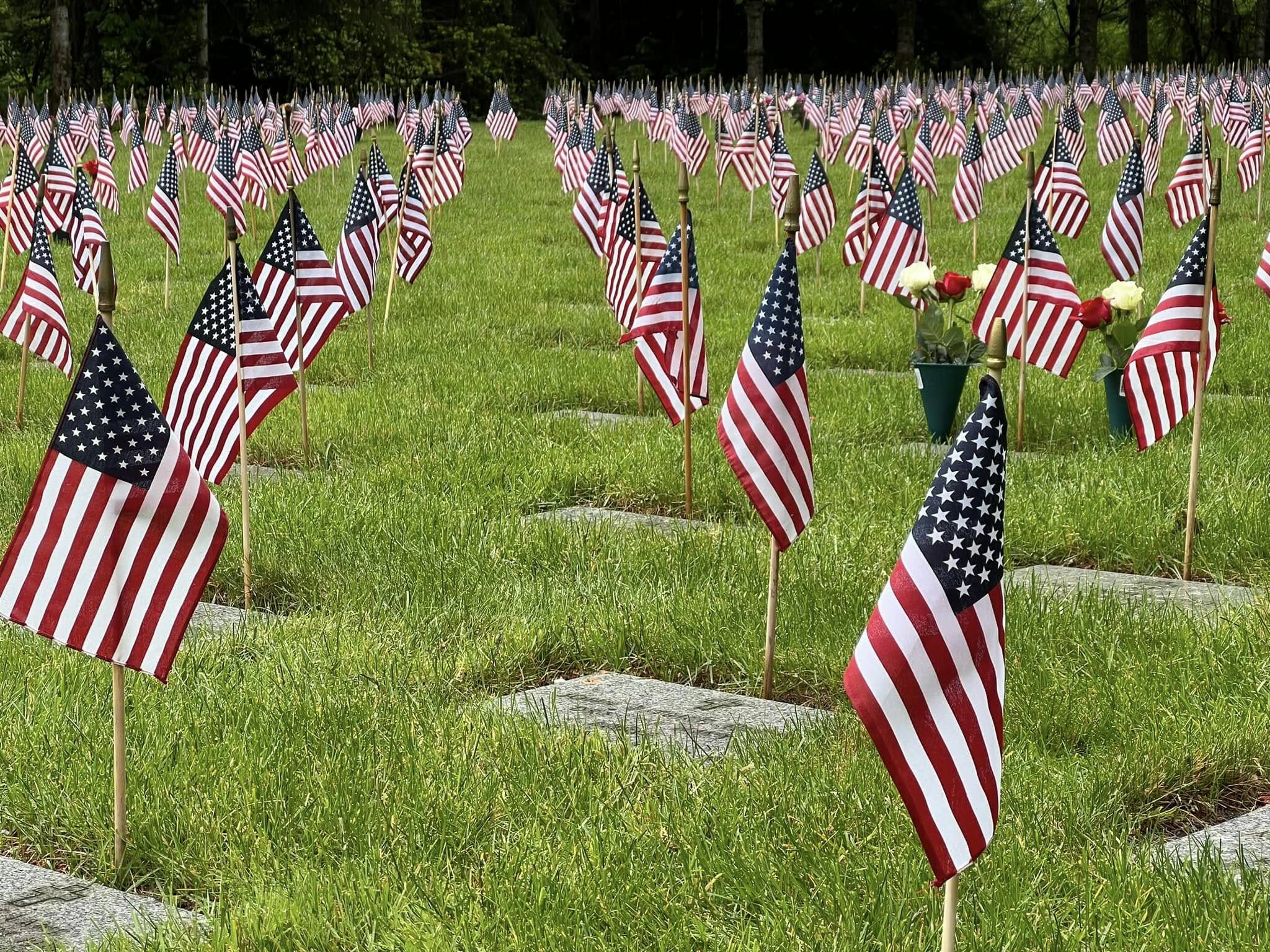 Small American flags adorn headstones at Tahoma National Cemetery in Kent. Photo Courtesy of Tahoma National Cemetery.