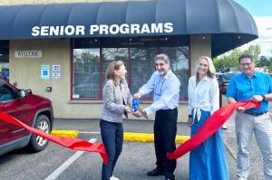 Rep. Kim Schrier (WA-8) cutting the ribbon to celebrate renovations to the Enumclaw Senior Center with Enumclaw Mayor Jan Molinaro, Senior Center Director Melissa Holt, and City Administrator Chris Searcy. Courtesy photo