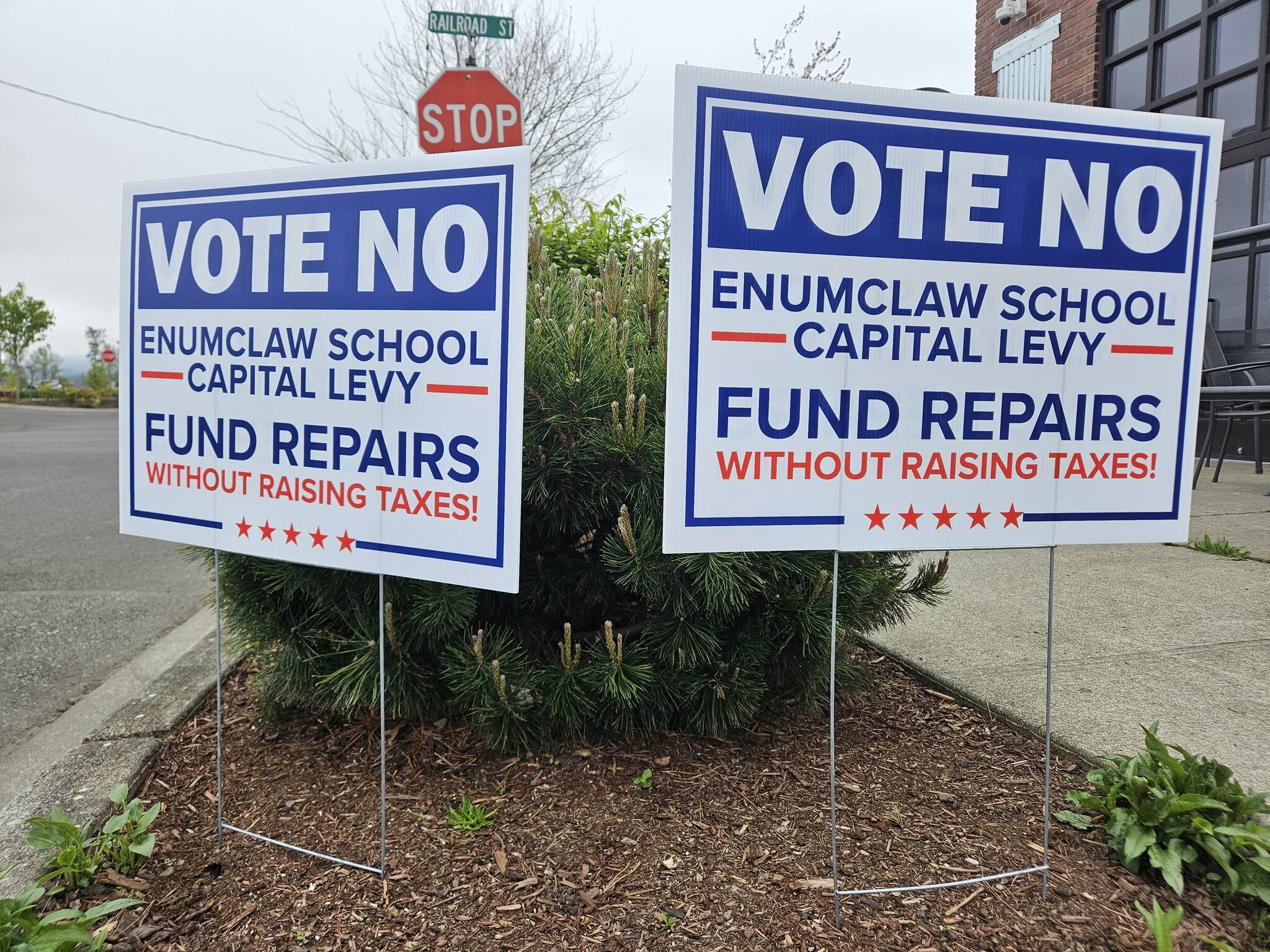 Photo by Ray Miller-Still
A pair of signs urging locals to reject the proposed Enumclaw School District levy on the April 22 ballot.