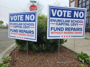 Photo by Ray Miller-Still
A pair of signs urging locals to reject the proposed Enumclaw School District levy on the April 22 ballot.