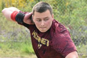 PHOTO BY KEVIN HANSON White Rivers Dainton Neff was a three-time champion May 8 when the Hornets hosted neighboring Enumclaw High. In this photo hes in the process of winning the shot put; the senior also took first place in the discus and javelin.