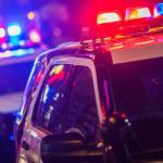 Night Time Police Violent Crime Intervention. Police Vehicles with Flashing Lights.