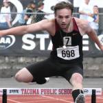 PHOTO BY KEVIN HANSON 
Enumclaw High senior Amos Hall nears the end of his 300-meter hurdle race Friday at the state track meet, staged at Mount Tahoma High School in Tacoma.