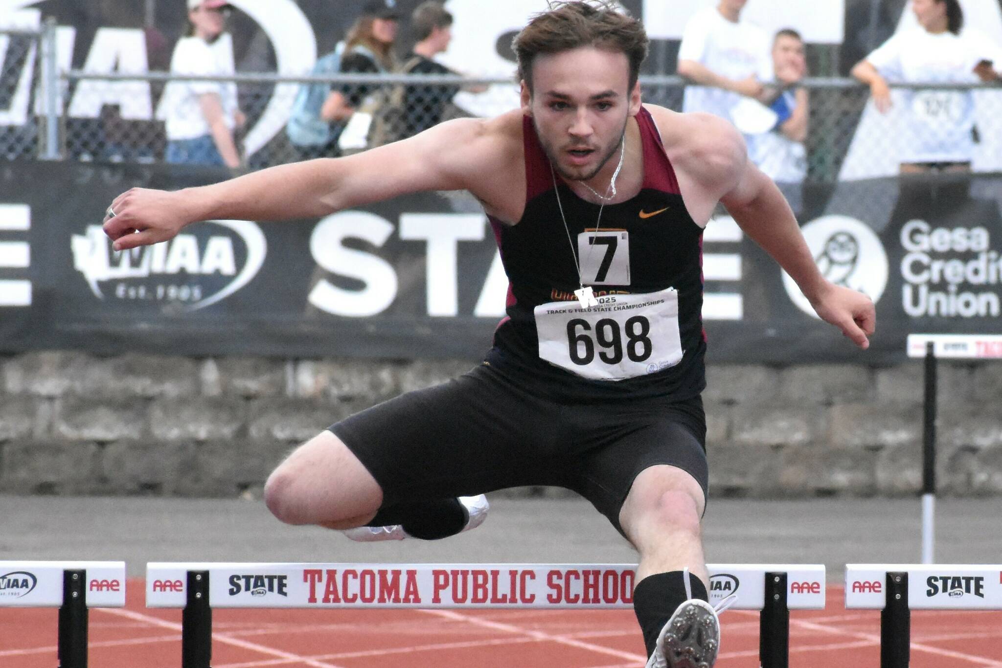 PHOTO BY KEVIN HANSON Enumclaw High senior Amos Hall nears the end of his 300-meter hurdle race Friday at the state track meet, staged at Mount Tahoma High School in Tacoma.