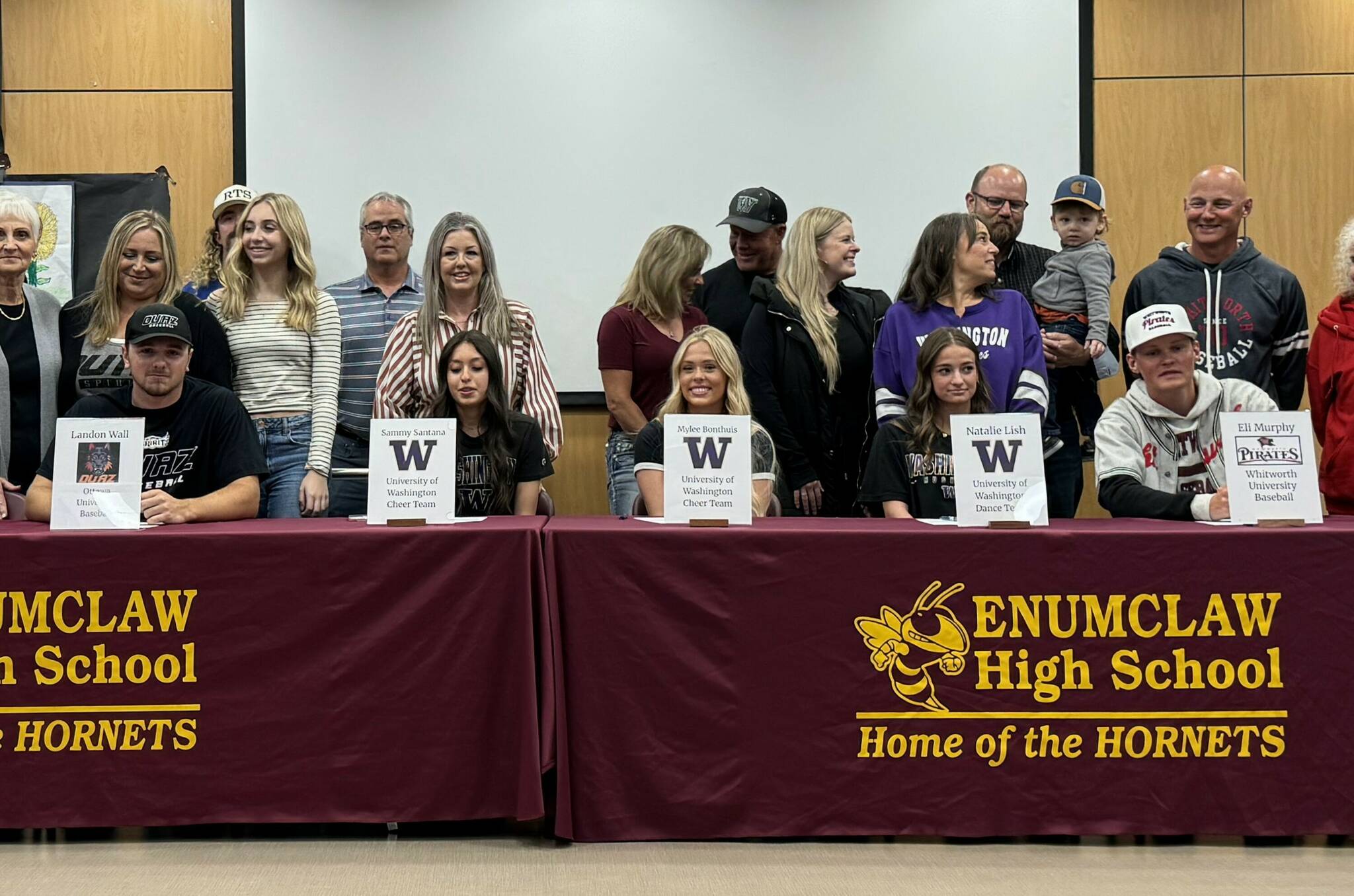 SUBMITTED PHOTO 
Committing to the their collegiate futures, joined by family and friends, were (from left): Landon Wall, Sammy Santana, Mylee Bonthuis, Natalie Lish and Eli Murphy.