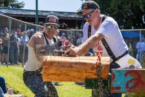 Photo by Ashley Britschgi / www.ashleyb.johnlscott.com
The 51st annual Log Show, Buckleys biggest event of the year, did not disappoint  the stands were crowded to the brim with fans to watch local loggers show off their speed, strength, and fortitude as they competed in 19 grueling events on two hot days. Pictured single bucking with Jeff Fetter is Jalen Johansen, who placed second this year. Also pictured is Devon Barker during the obstacle choker setting event.