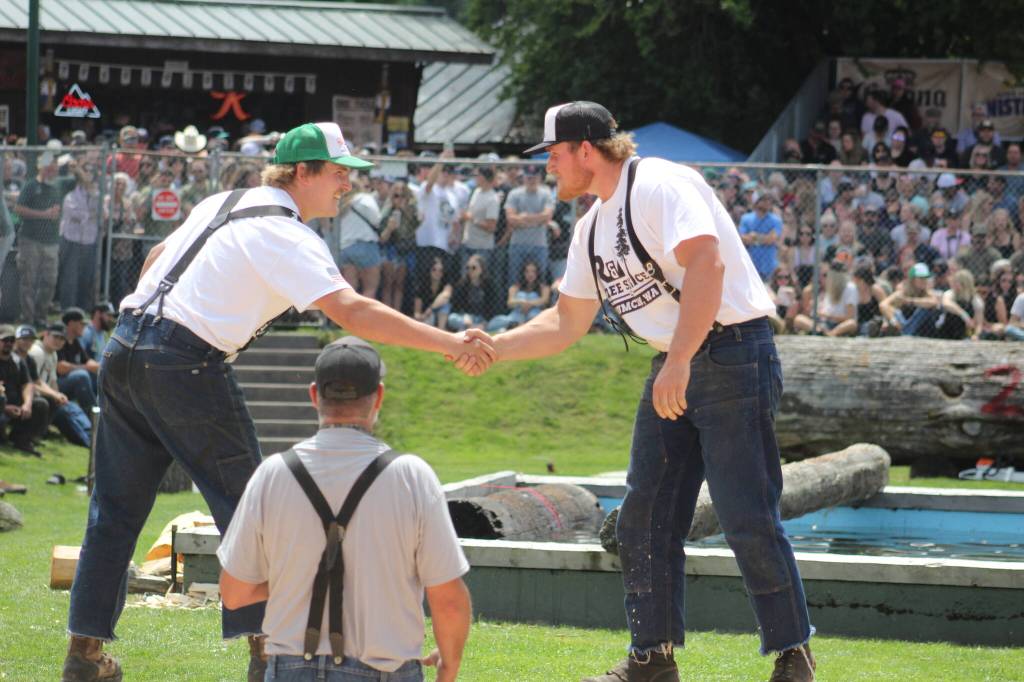 Photo by Ray Miller-Still 
Sometimes the Log Show is a family affair. Pictured here are brothers Ryker and Ryder Popke wishing each other luck before the choker setting event.