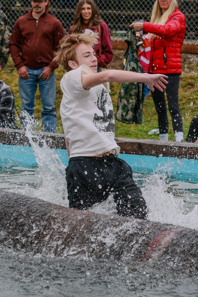 Riley Skogen placed third in the log rolling event. Photo by Ashley Britschgi