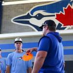 PHOTO COURTESY TORONTO BLUE JAYS 
Enumclaw product Dylan Watts joins Blue Jays coaches and other drafted players just days after being drafted by the major league team. Watts is in the center, directly behind the orange cone.