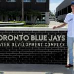 PHOTO COURTESY JENNIFER WATTS After arriving in Tampa, Florida, Dylan Watts stands at the entry to the Toronto Blue Jays Player Development Complex.