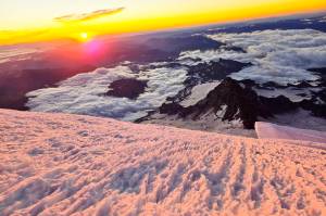 Sunrise at the summit of Mount Rainier is a spectacle only the fittest, bravest, and lucky climbers will experience. Photo courtesy Brent Okita