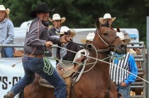 Riley Carel is an unusual rodeo competitor in that he doesnt run a farm or own a ranch. Instead, he works at Babbitt Insurance. Here he is at the Longview, WA Rodeo in late July. Photo by Elaine Kimball / Elaines Images