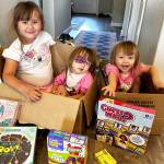 Safina, center, with her sister Eliana and twin Karina settling into the Airbnb they will be staying in while Safina gets her surgery and aftercare. Courtesy photo
