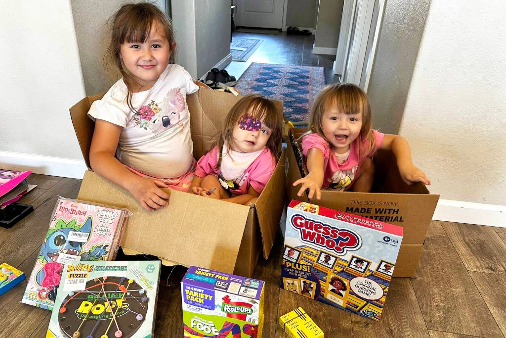 Safina, center, with her sister Eliana and twin Karina settling into the Airbnb they will be staying in while Safina gets her surgery and aftercare. Courtesy photo