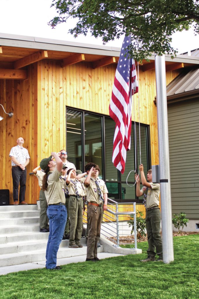 Photo by Ray Miller-Still
Boy Scout Troop 577 raised the flag at Buckleys new City Hall during the ribbon cutting ceremony.