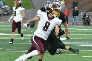 FILE PHOTO BY KEVIN HANSON 
White River senior Ray Palmer will have the opportunity to shine on both sides of the ball this fall. In this photo from a season ago he picks up yardage after a reception.