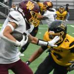 PHOTO BY KEVIN HANSON 
White River running back Mason Locke looks to avoid a Raider tackler during Friday nights Hornet victory.