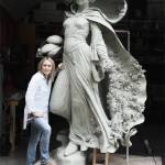 Artist Mardie Rees with her statue of the Miracle of Roses. Submitted photo