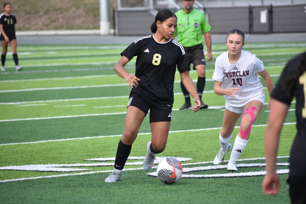 Lavinia Suazo looks for a teammate to pass to for Decatur.