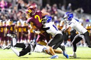 PHOTO COURTESY VINCE MILLER Kovi Poulin (2) fights his way inside the 10-yard line during White Rivers victory over Federal Way.