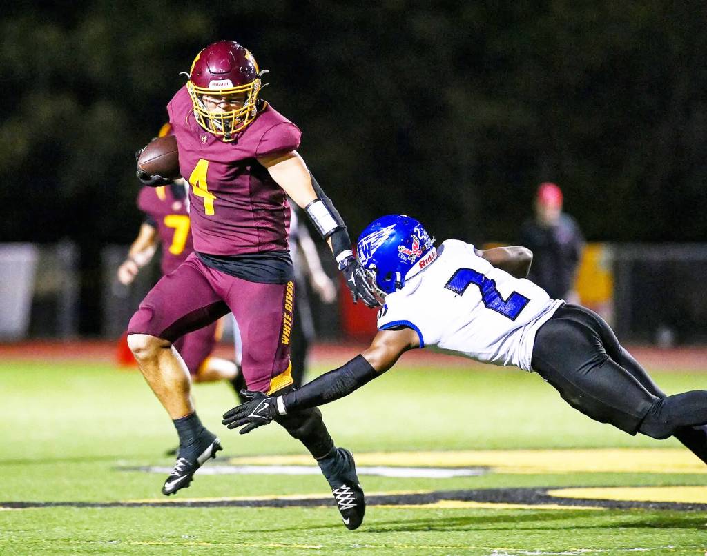 PHOTO COURTESY VINCE MILLER White River running back Blake Bargelt (4) makes his way past Eagle defender Zamarie Tellez.