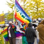 Pro-LGBTQ signs and attire were a common theme at the protest. Photo by Ray Miller-Still