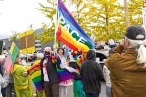 Pro-LGBTQ signs and attire were a common theme at the protest. Photo by Ray Miller-Still