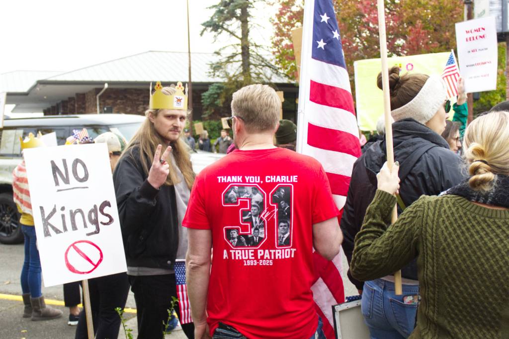 It was not an uncommon sight to see demonstrators and counter-demonstrators in conversation. Photo by Ray Mille-Still