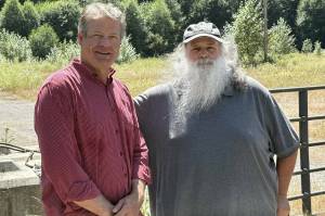 Photo by Drew Dotson/Renton Reporter
King County Council Vice Chair Reagan Dunn (left) and Bob Baker of Save the Cedar River (right) stand in front of the lot that will no longer be the site of an asphalt plant near the Cedar River. Instead, Dunn hopes to turn it into a public park for land preservation.