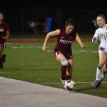 Shannon Mclain dribbles the ball down the sideline for Kentlake. Ben Ray / Sound Publishing