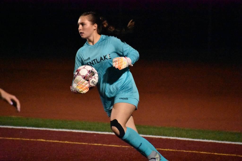 Grace Engebo holds the ball for Kentlake. Ben Ray / Sound Publishing