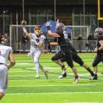 WRHS Chaz Strickland (No. 7) attempts to pass to Blake Bargelt (4). Photo by Vic Wright
