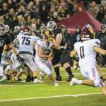 White River's Kovi Poulin does his best to navigate Enumclaw's defense. Photo by Vic Wright
