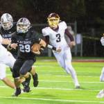 Enumclaw senior Cole Chiechi gaining some yardage before being taken down by White River. Photo by Vic Wright
