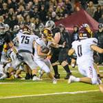 Photos by Vic Wright
White Rivers Kovi Poulin does his best to navigate Enumclaws defense.