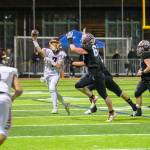 WRHS Chaz Strickland (No. 7) attempts to pass to Blake Bargelt (4). Photo by Vic Wright